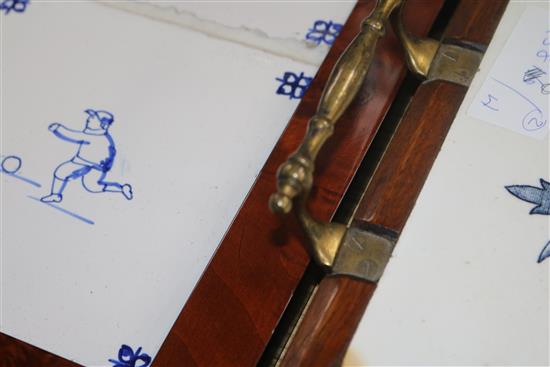 A set of four framed 18th century Dutch Delft tiles and two later tiles as a tray